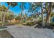 A charming neighborhood with colorful homes and sidewalks, all shaded by mature trees at 330 Pineapple St, Tarpon Springs, FL 34689