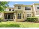 View of the backyard of the property, featuring a lawn and a screened in porch at 3429 Heards Ferry Dr, Tampa, FL 33618