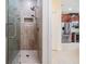 Beautiful bathroom boasts glass enclosed shower with dual shower heads and ceramic tile at 3429 Heards Ferry Dr, Tampa, FL 33618