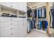 Organized walk-in closet with custom shelving and ample storage for clothing and accessories at 3429 Heards Ferry Dr, Tampa, FL 33618