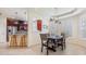 Cozy dining room with a view to the kitchen, complete with dark wood cabinets and bar seating area at 3429 Heards Ferry Dr, Tampa, FL 33618