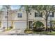 Charming townhome with a two-car garage, manicured landscaping, and a welcoming entrance at 3429 Heards Ferry Dr, Tampa, FL 33618