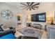Comfortable living room with tile flooring, neutral paint, ceiling fan, and modern furnishings at 3429 Heards Ferry Dr, Tampa, FL 33618