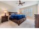 The main bedroom is roomy, with a ceiling fan, and natural lighting from the windows at 3429 Heards Ferry Dr, Tampa, FL 33618