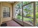 Serene screened patio overlooking a well-maintained backyard, providing an ideal outdoor living space at 3429 Heards Ferry Dr, Tampa, FL 33618