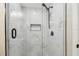 The bathroom features a glass walk-in shower with luxurious marble tile and updated hardware at 3838 29Th N St, St Petersburg, FL 33714
