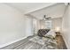 This bedroom features gray wood-look flooring, natural light, and Welcome Home pillow at 3838 29Th N St, St Petersburg, FL 33714