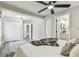 Spacious bedroom features gray wood-look flooring, bathroom, and closets at 3838 29Th N St, St Petersburg, FL 33714