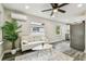 Bright living room featuring modern decor, stylish ceiling fan, and durable grey flooring at 3838 29Th N St, St Petersburg, FL 33714