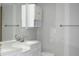 Modern bathroom featuring double sinks, vanity with white cabinets, and sleek fixtures at 3861 Sailmaker Ln # 3861, Holiday, FL 34691