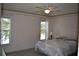 Well-lit bedroom with two windows overlooking the outdoors at 3861 Sailmaker Ln # 3861, Holiday, FL 34691