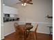 Cozy dining area featuring hardwood floors and a wooden table perfect for Gathering meals at 3861 Sailmaker Ln # 3861, Holiday, FL 34691