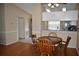 Inviting dining area featuring hardwood floors, with easy access to the kitchen and entrance at 3861 Sailmaker Ln # 3861, Holiday, FL 34691