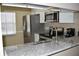 Bright kitchen featuring stainless steel appliances, granite countertops, and natural light at 3861 Sailmaker Ln # 3861, Holiday, FL 34691