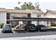 Exterior view of parking spots in front of well-maintained condos and landscaped surroundings at 3861 Sailmaker Ln # 3861, Holiday, FL 34691