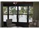 Screened in patio showing serene lake view with fountain and comfortable seating at 3861 Sailmaker Ln # 3861, Holiday, FL 34691