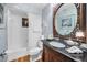 Bathroom featuring a vanity with dark marble countertop and a shower with a decorative curtain at 420 Hanby St, Crystal Beach, FL 34681