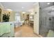 Bright bathroom featuring a clawfoot tub, decorative vanity, and glass shower with tiled walls at 420 Hanby St, Crystal Beach, FL 34681