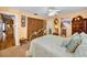 Bedroom with a unique metal bed frame, classic dresser, and decorative accents at 420 Hanby St, Crystal Beach, FL 34681