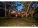 Charming home surrounded by mature trees, offering a unique architectural style and a serene setting at 420 Hanby St, Crystal Beach, FL 34681