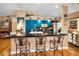 Bright kitchen with black countertops, bar stool seating and blue cabinets at 420 Hanby St, Crystal Beach, FL 34681