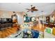 Open-concept living room with hardwood floors, modern decor, seamlessly connecting to the kitchen and dining area at 420 Hanby St, Crystal Beach, FL 34681