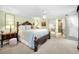 Spacious main bedroom with a ceiling fan and ensuite bathroom at 420 Hanby St, Crystal Beach, FL 34681