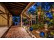 Outdoor patio featuring brick pavers, decorative pottery, and lush landscaping, ideal for relaxing and entertaining at 420 Hanby St, Crystal Beach, FL 34681