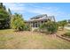 Relaxing backyard with a screened-in patio and lush landscaping for privacy at 4270 Boston Cir, New Port Richey, FL 34653