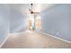 Comfortable bedroom with ceiling fan and carpet flooring, open to the ensuite bathroom at 4270 Boston Cir, New Port Richey, FL 34653