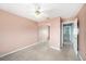 This bedroom features neutral carpet and a closet with mirrored doors at 4270 Boston Cir, New Port Richey, FL 34653