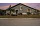 Single-story home with well-maintained lawn, inviting entrance, and classic architectural details at 4270 Boston Cir, New Port Richey, FL 34653