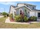Charming two-story home featuring lush landscaping, well-maintained lawn, and a welcoming exterior at 4270 Boston Cir, New Port Richey, FL 34653