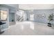 Spacious living room with tile flooring, staircase, and plenty of natural light at 4270 Boston Cir, New Port Richey, FL 34653