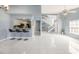 Bright living area features tiled floors, kitchen access, breakfast bar and staircase at 4270 Boston Cir, New Port Richey, FL 34653
