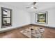 Cozy bedroom with hardwood floors, a modern ceiling fan, and a bay window at 430 Hickory Nut, Oldsmar, FL 34677