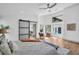 Light filled bedroom with wood floors, sliding door, many windows and views of a swimming pool at 430 Hickory Nut, Oldsmar, FL 34677