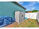 Backyard featuring a shed, white fence, and neatly maintained landscaping at 5103 Rushbrook Rd, Land O Lakes, FL 34638