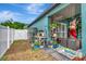 Backyard gardening area featuring potting table, outdoor storage shed, and access to the home's rear entrance at 5103 Rushbrook Rd, Land O Lakes, FL 34638