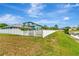 Fenced backyard with a view of a tranquil pond at 5103 Rushbrook Rd, Land O Lakes, FL 34638