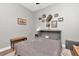 Simple bedroom featuring a comfortable murphy bed, hardwood floors and decorative touches at 5103 Rushbrook Rd, Land O Lakes, FL 34638