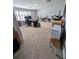 Large bonus room with a large desk, neutral walls, and carpet at 5103 Rushbrook Rd, Land O Lakes, FL 34638