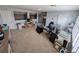 Spacious bonus room with multiple work spaces, neutral walls, and carpet at 5103 Rushbrook Rd, Land O Lakes, FL 34638
