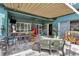 Back patio including a built in grill, furniture, bar, refrigerator, and decorative accents at 5103 Rushbrook Rd, Land O Lakes, FL 34638
