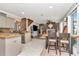 Open concept dining area flowing from kitchen and living room with views of the outside and stylish decor at 5103 Rushbrook Rd, Land O Lakes, FL 34638