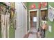 Hallway featuring a closet, wood floors, and a view into the bathroom at 5103 Rushbrook Rd, Land O Lakes, FL 34638