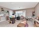 Cozy home office with a large window, comfortable furniture, and neutral color palette at 5103 Rushbrook Rd, Land O Lakes, FL 34638