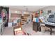 Spacious home office featuring ample storage and comfortable seating with gray carpet flooring at 5103 Rushbrook Rd, Land O Lakes, FL 34638