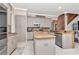 Open concept kitchen features stainless steel appliances, granite countertops and light gray cabinets at 5103 Rushbrook Rd, Land O Lakes, FL 34638