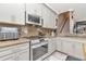 Well-lit kitchen featuring granite countertops, modern appliances, and plenty of cabinet space at 5103 Rushbrook Rd, Land O Lakes, FL 34638